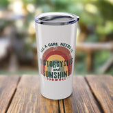 White tumbler with 'motorcycles and sunshine' text design on a white background